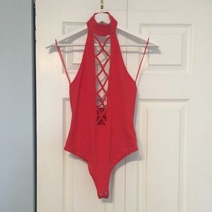 Black bodysuit, open cross crossed abdominal/chest